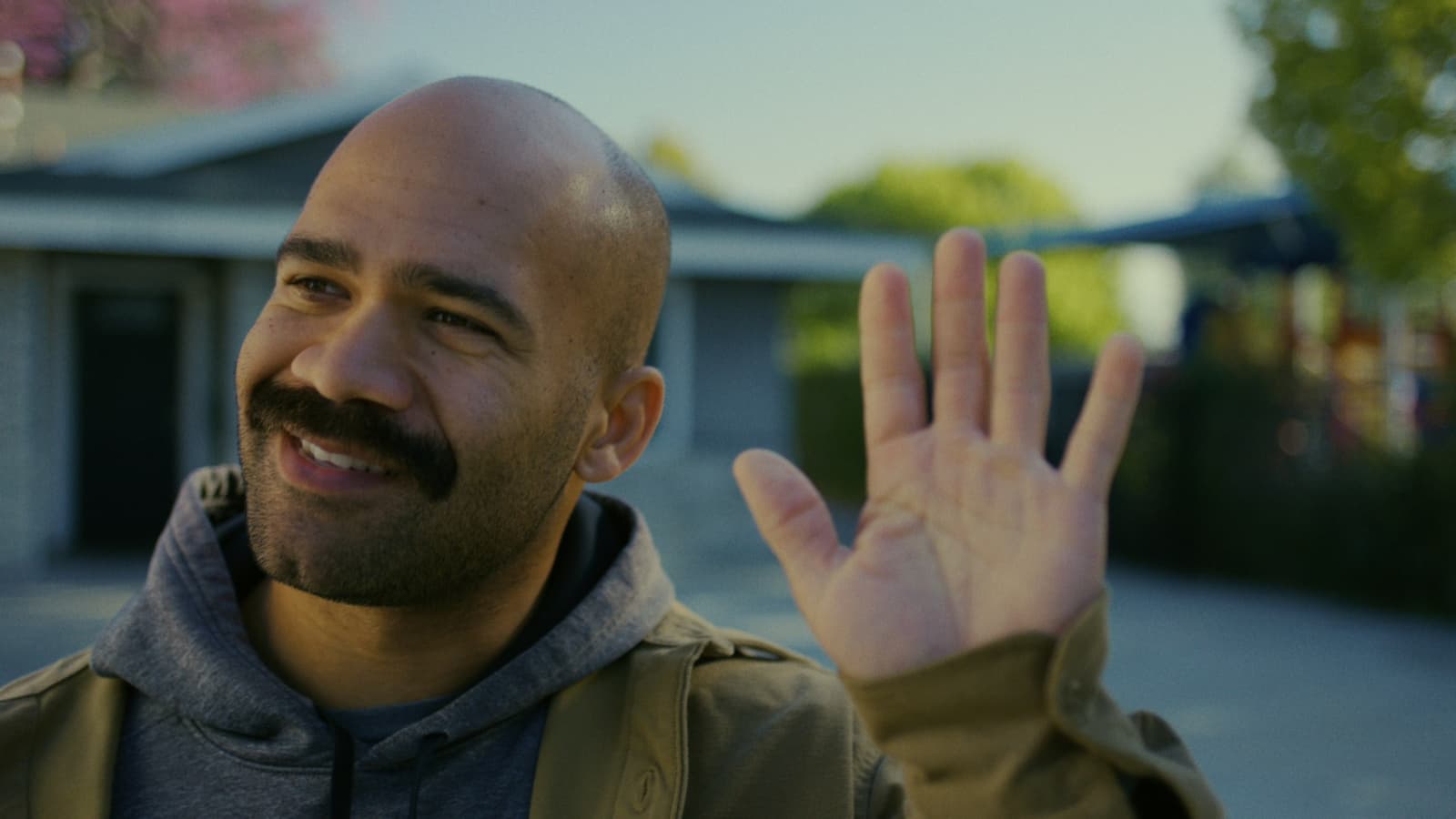 Eric waving near the mailbox